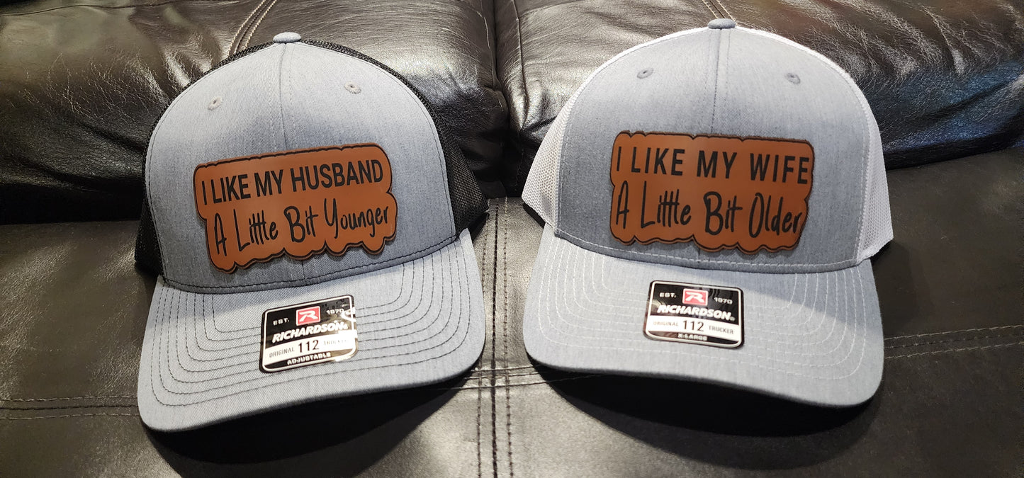 Couple hats " I like my husband a little bit younger " & " I like my wife a little bit older "