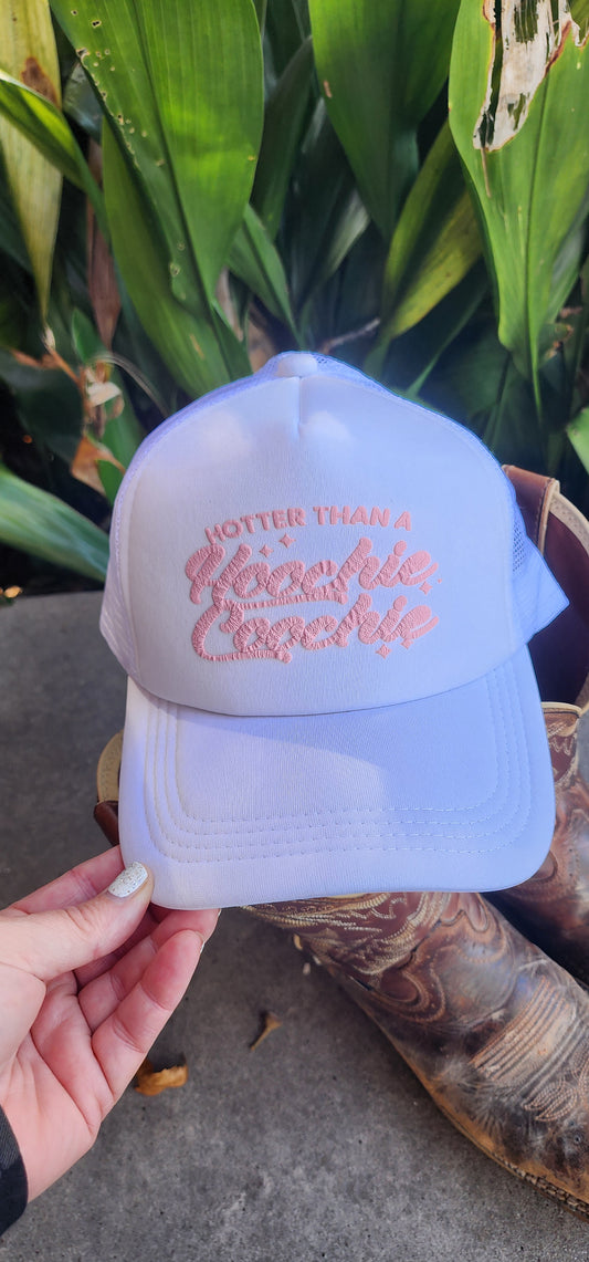 White trucker hat, "HOTTER THAN A HOOCHIE COOCHIE"